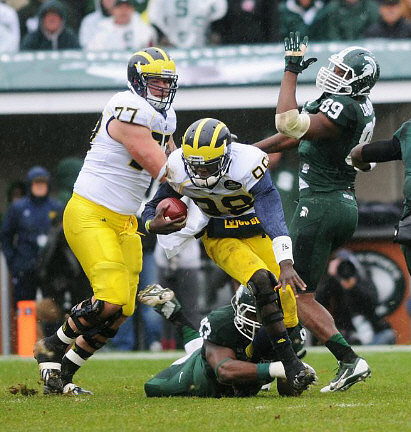 Taylor Lewan (77) and Devin Gardner (98)