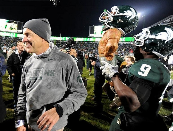Michigan State Head Coach Mark Dantonio and Paul Bunyan Trophy