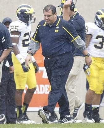 Dymonte Thomas (25) and Brady Hoke