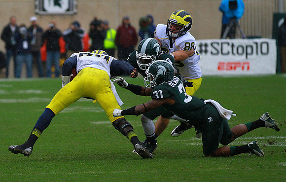 Devin Gardner (98) and Jake Butt (88)