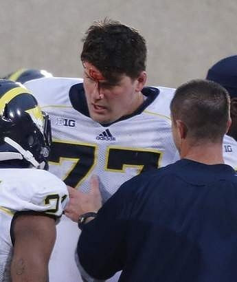 Jeremy Gallon (21) and Taylor Lewan (77)