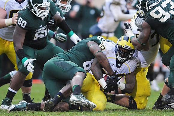 Fitzgerald Toussaint (28) and Michael Schofield (75)