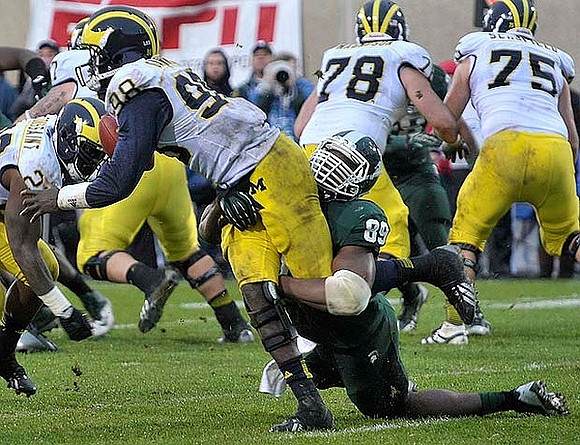 Fitzgerald Toussaint (28), Devin Gardner (98), Erik Magnuson (78), and Michael Schofield (75)