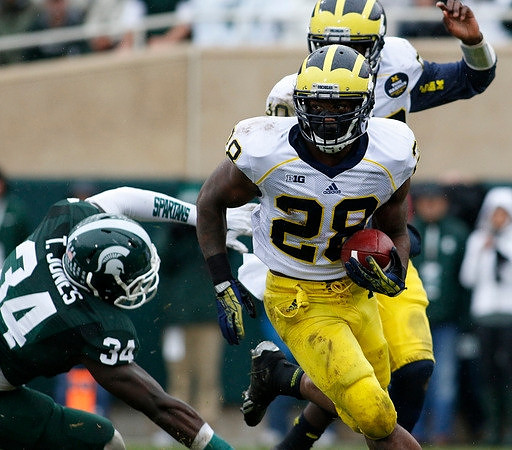 Fitzgerald Toussaint (28) and Devin Gardner (98)