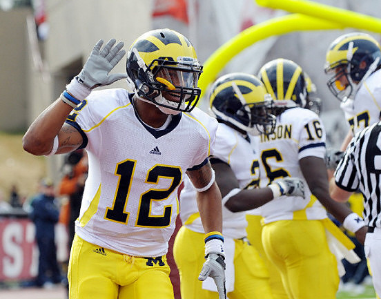 Roy Roundtree (12), Vincent Smith (2), Denard Robinson (16), and Taylor Lewan (77)