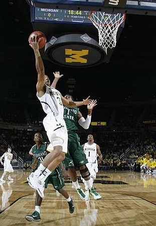 Trey Burke (3), Glenn Robinson III (1), and Matt Vogrich (13)
