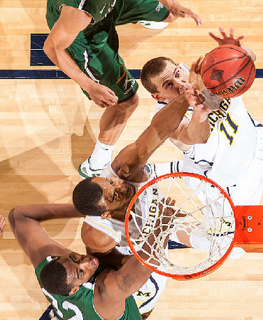 Jon Horford (15) and Nik Stauskas (11)