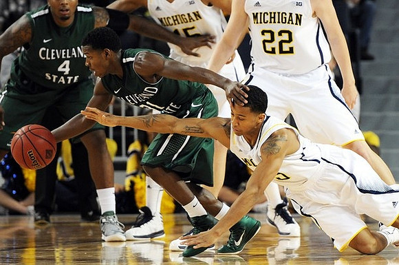 Trey Burke (3), Blake McLimans (22), and Jon Horford (15)