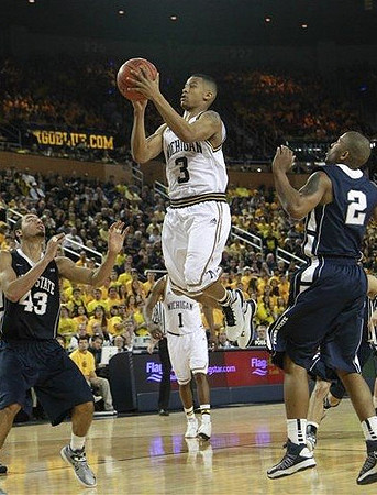Trey Burke (3) and Glenn Robinson III (1)