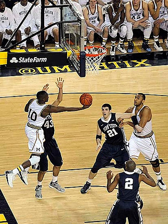Tim Hardaway Jr. (10) and Jon Horford (15)