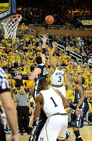 Trey Burke (3) and Glenn Robinson III (1)