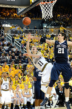 Nik Stauskas (11) and Trey Burke (3)