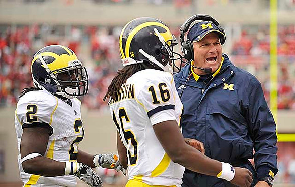 Vincent Smith (2), Denard Robinson (16), and Rich Rodriguez
