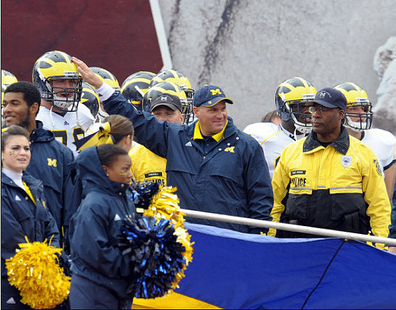 Perry Dorrestein (79) and Rich Rodriguez