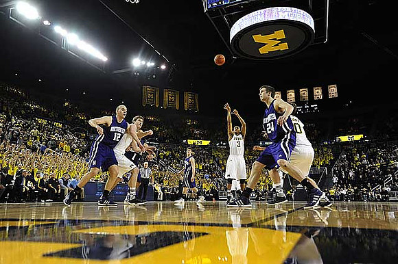 Evan Smotrycz (23), Trey Burke (3), and Tim Hardaway Jr. (10)
