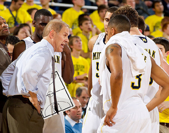 Tim Hardaway Jr. (10), John Beilein, Jordan Morgan (52), Trey Burke (3), and Zack Novak (0)