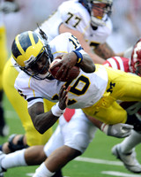 Taylor Lewan (77) and Denard Robinson (16)