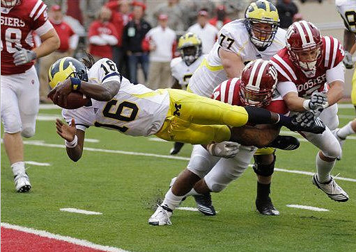 Denard Robinson (16) and Taylor Lewan (77)