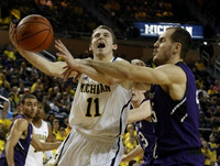 Nik Stauskas (11) and Glenn Robinson III (1)