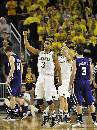 Trey Burke (3) and Zack Novak (0)