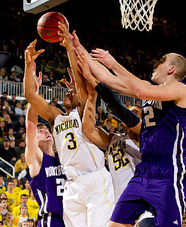 Trey Burke (3) and Jordan Morgan (52)