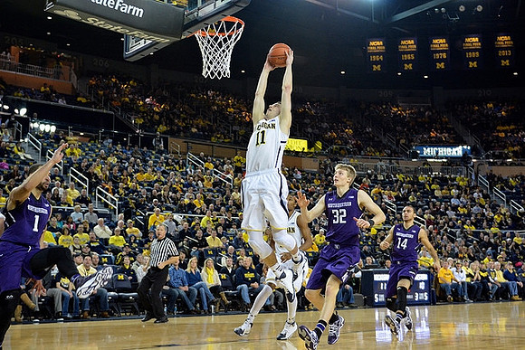 Nik Stauskas (11) and Zak Irvin (21)