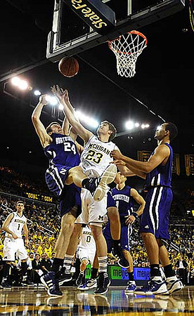 Stu Douglass (1), Evan Smotrycz (23), and Zack Novak (0)