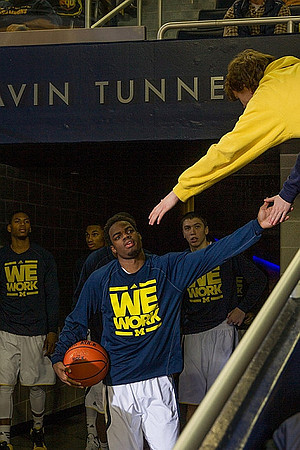 Derrick Walton Jr. (10), Glenn Robinson III (1), and Sean Lonergan (20)