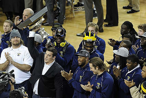 Ryan Van Bergen, David Molk, and J.B. Fitzgerald, Kevin Koger, and the Sugar Bowl Trophy