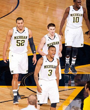 Jordan Morgan (52), Trey Burke (3), Stu Douglass (1), Tim Hardaway Jr. (10), and John Beilein