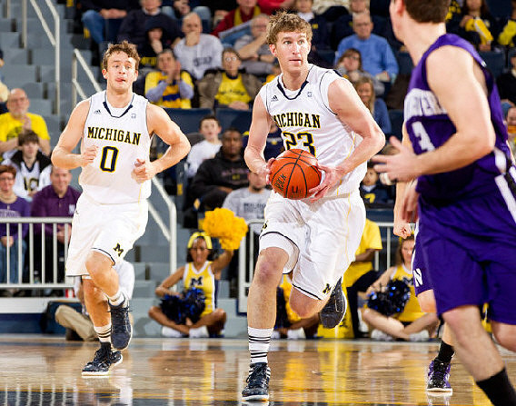 Zack Novak (0) and Evan Smotrycz (23)
