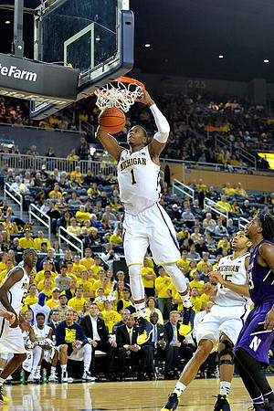 Caris LeVert (23), Glenn Robinson III (1), and Jon Horford (15)