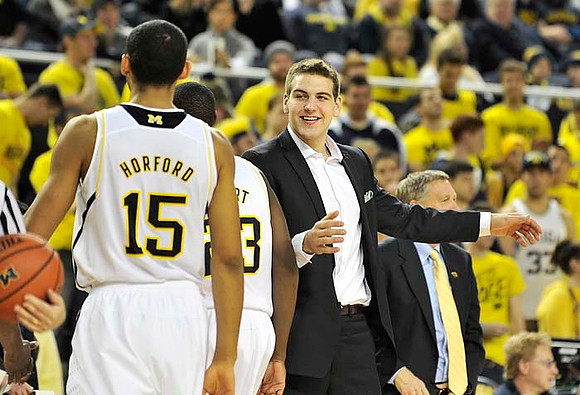 Jon Horford (15), Caris LeVert (23), Mitch McGary (4), and Jeff Meyer