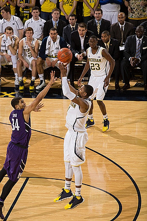Glenn Robinson III (1) and Caris LeVert (23)