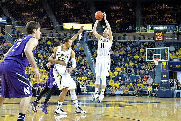 Jordan Morgan (52) and Nik Stauskas (11)