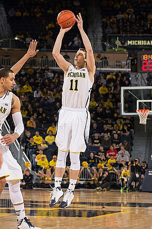 Jordan Morgan (52) and Nik Stauskas (11)