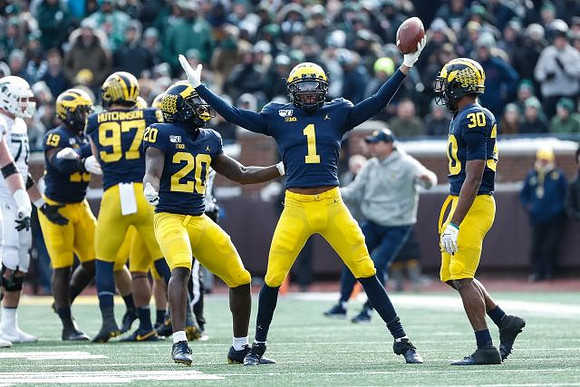 Kwity Paye (19), Aidan Hutchinson (97), Brad Hawkins (20), Ambry Thomas (1), and Daxton Hill (30)