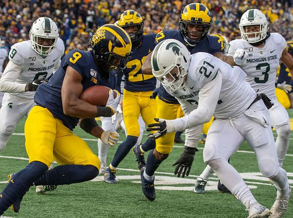 Donovan Peoples-Jones (9) and Hunter Reynolds (27)