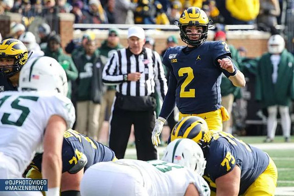 Ben Bredeson (74), Jon Runyan Jr. (75), and Shea Patterson (2)