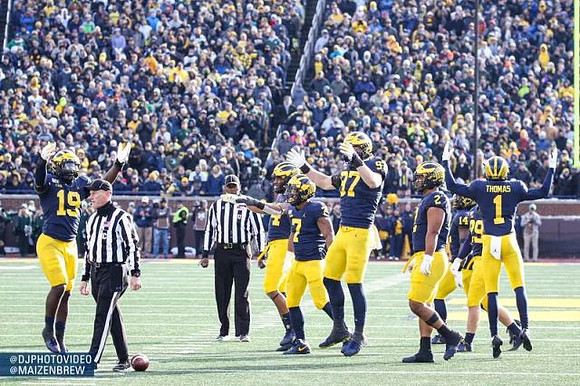 Kwity Paye (19), Khaleke Hudson (7), Aidan Hutchinson (97), Carlo Kemp (2), Ambry Thomas (1), and Jordan Glasgow (29)