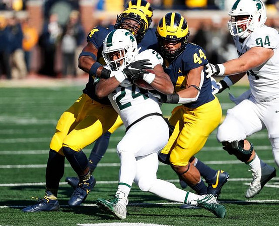 Josh Metellus (14) and Cameron McGrone (44)