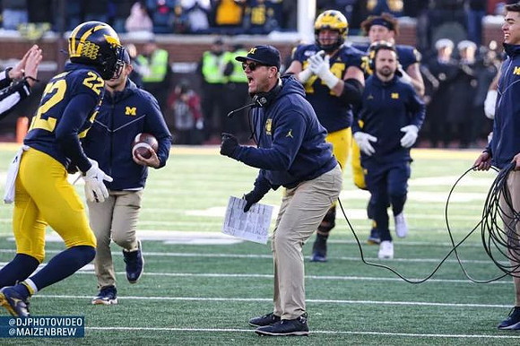 Gemon Green (22), Jim Harbaugh, and Ben Bredeson (74)