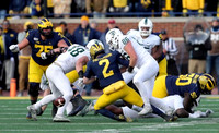 Jon Runyan Jr. (75), Shea Patterson (2), and Michael Onwenu (50)