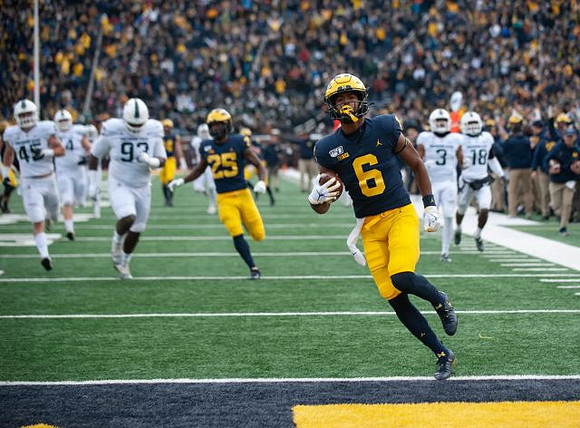 Hassan Haskins (25) and Cornelius Johnson (6)