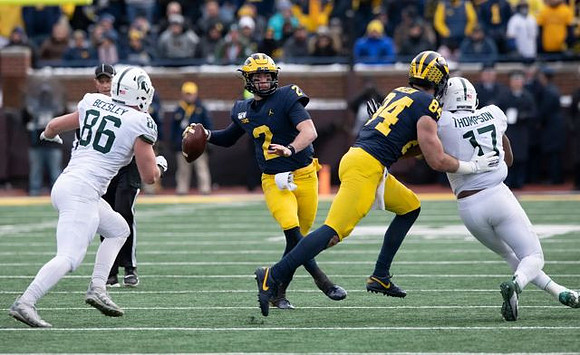 Shea Patterson (2) and Sean McKeon (84)