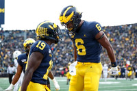 Mike Sainristil (19) and Cornelius Johnson (6)