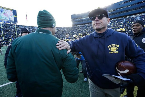 Michigan State Head Coach Mark Dantonio and Jim Harbaugh