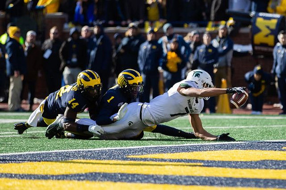 Josh Metellus (14) and Ambry Thomas (1)