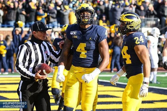 Nico Collins (4) and Zach Charbonnet (24)