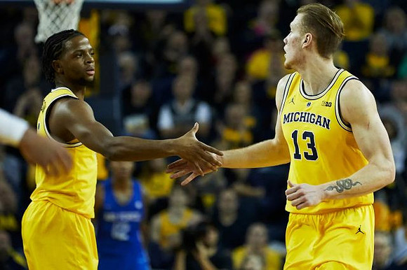 Zavier Simpson (3) and Ignas Brazdeikis (13)